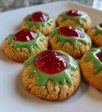 grinch thumbprint raspberry cookies